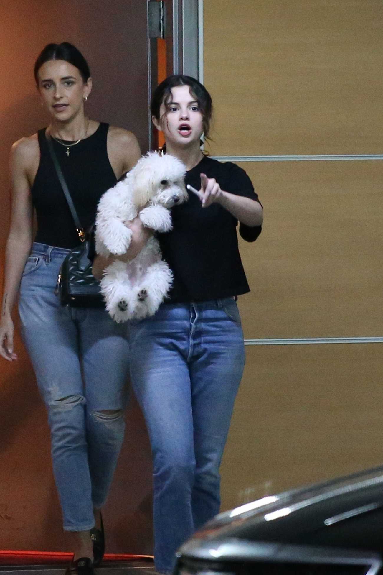 Selena_Gomez_-_leaving_a__Shark_Tank__filming_studio_with_her_puppy_in_West_Hollywood_September_232C_2019-03.jpg
