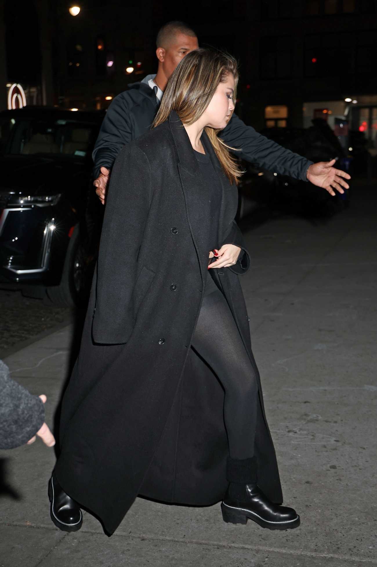 Taylor_Swift_and_Selena_Gomez_-_Arriving_at_Zero_Bond_in_New_York_December_122C_202309.jpg